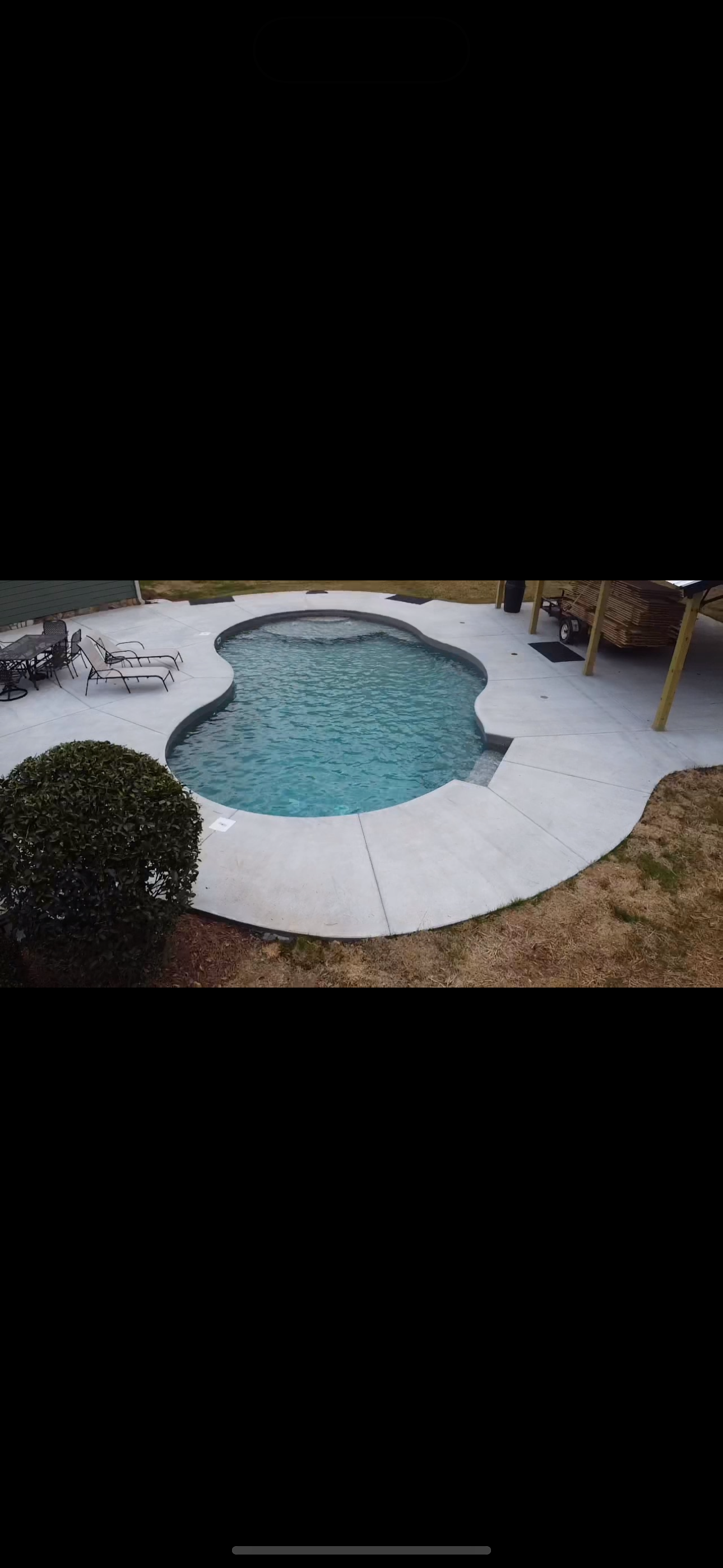 Completed vinyl liner pool — wide angle with landscaping